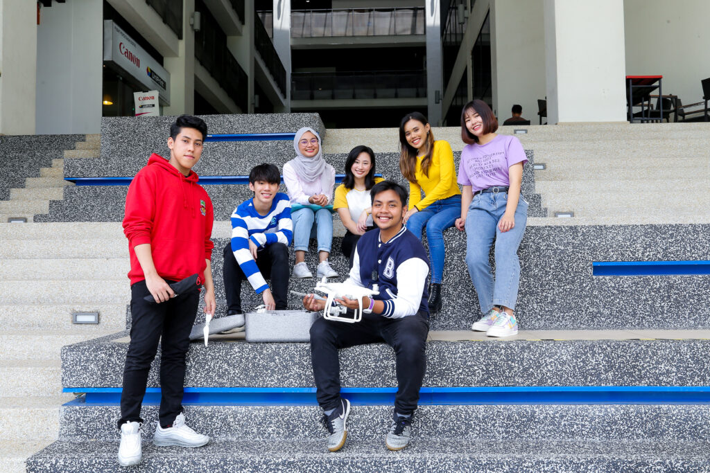 UOW Malaysia students with a drone at an Open Day, showcasing IT and engineering programs available after SPM.