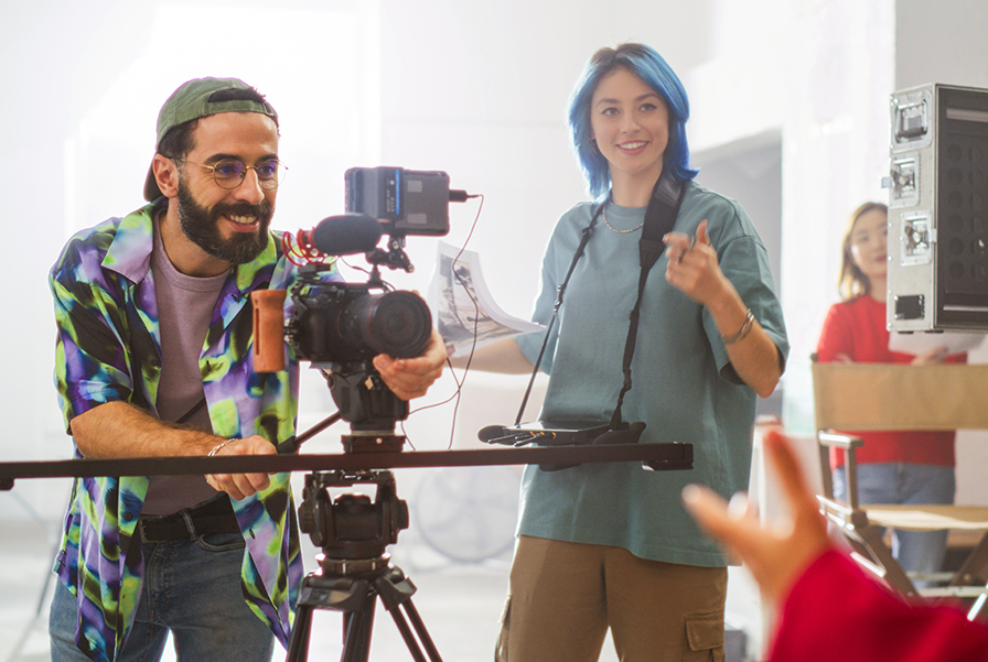 UOW Malaysia students collaborating on a film set, showcasing the teamwork and practical skills learned in the digital media production program.