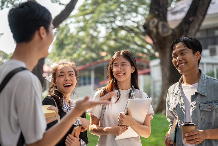 A group of happy students enjoying the vibrant student life and community at UOW Malaysia's Batu Kawan campus.